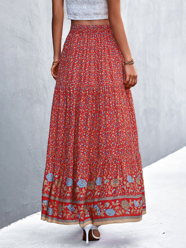 Red boho long skirt featuring a bold floral pattern and flowy design.
