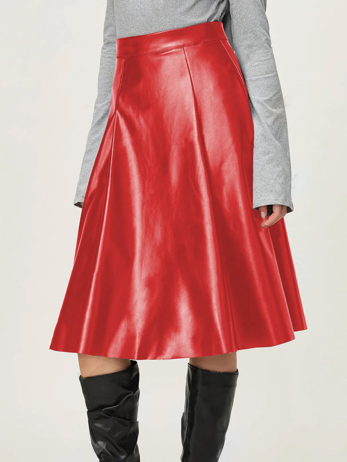 Red faux leather A-line skirt featuring a flattering, high-waisted design.
