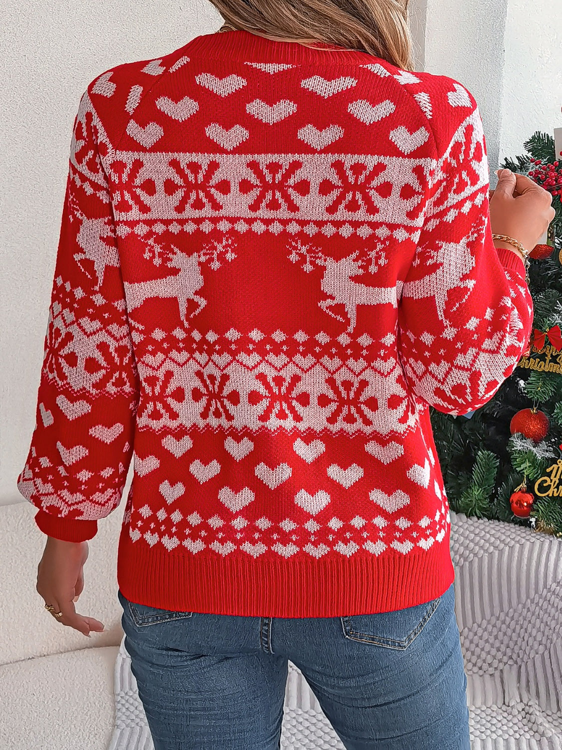 Back view of the red reindeer snowflake sweater, showcasing its cozy holiday design.

