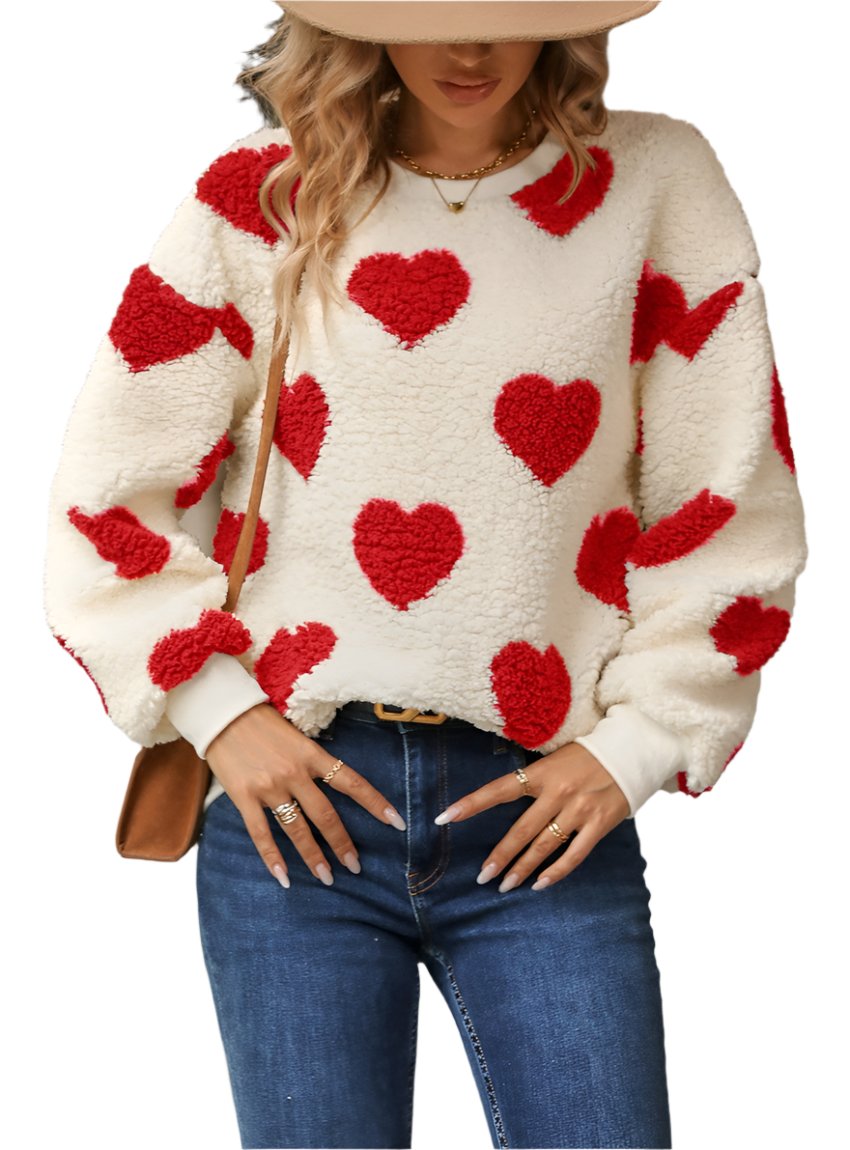 Woman wearing a red fuzzy heart dropped shoulder sweatshirt with blue jeans