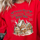 Vibrant red sweatshirt with a festive gingerbread bakery print for Christmas.