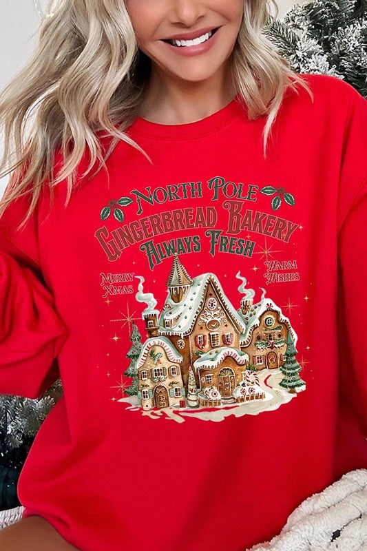 Vibrant red sweatshirt with a festive gingerbread bakery print for Christmas.