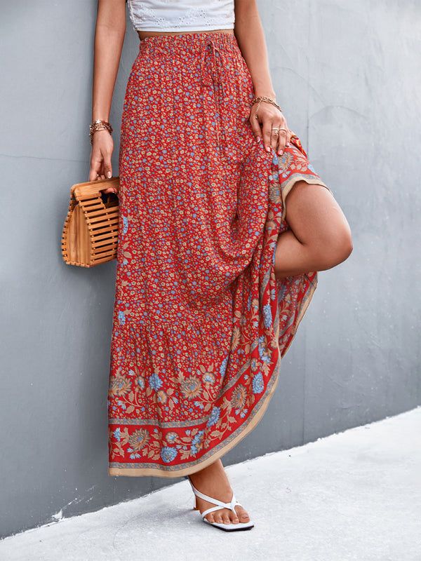 Front view of a red high-waist floral long skirt with a vibrant design.
