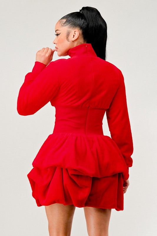 Red mock neck dress with a ruffled skirt for a fun and elegant silhouette.
