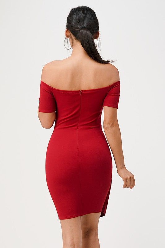 Classic red off-shoulder bodycon dress with a twist detail for a polished look.
