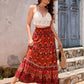 Red patchwork bohemian skirt styled for a casual summer look.
