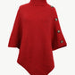 Red poncho with turtleneck and side button accents.
