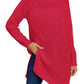 Woman wearing a cozy red turtleneck slit sweater.
