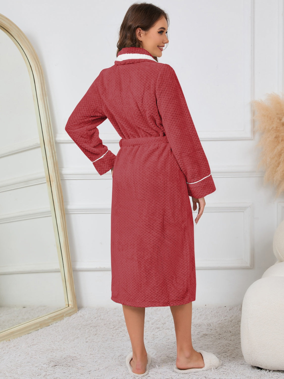 Belted red winter robe with contrast trim, ideal for cold mornings.
