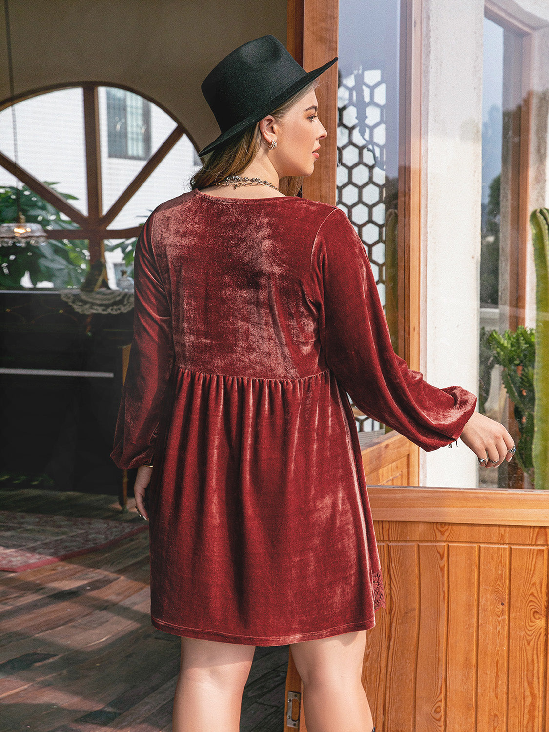 back view of reddish brown dress with lace hem
