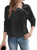 Relaxed fit of the black cable knit quarter-zip sweater, styled for casual and cozy wear.

