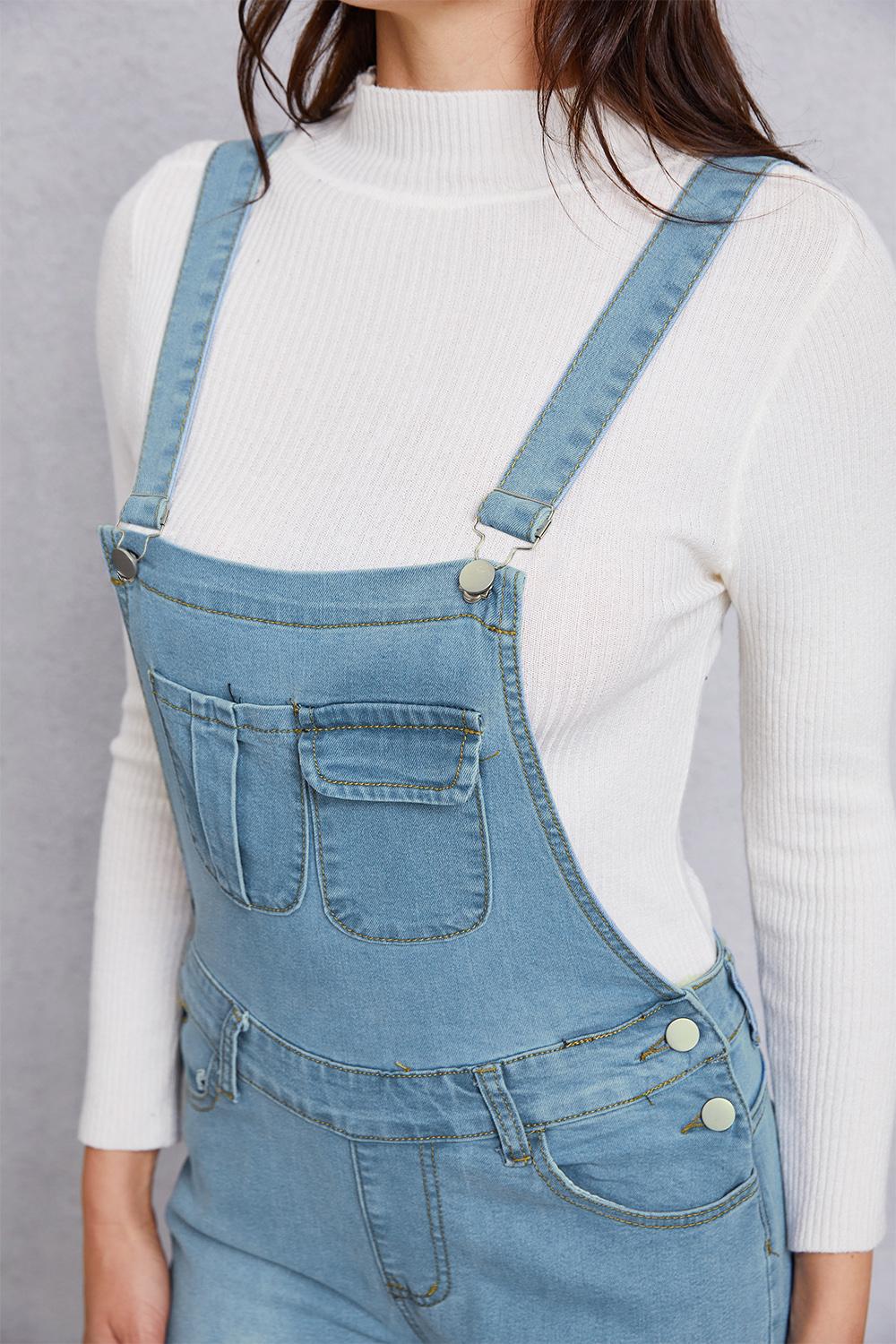 Slightly stretchy distressed denim light wash overalls styled for casual daytime wear.
