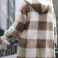 Relaxed fit plaid jacket with hood, ideal for layering in cold weather
