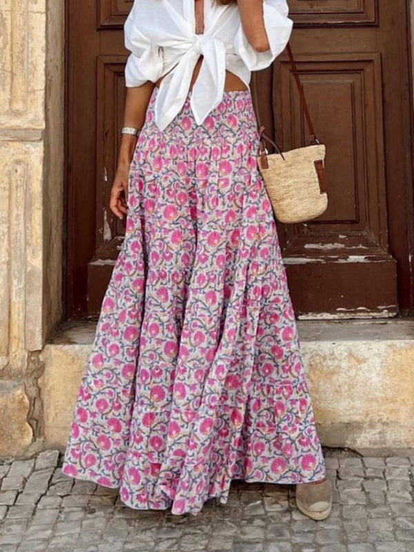 Resort-style pink long skirt featuring bold boho patterns.
