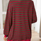 Brown and red striped oversized pullover styled casually with denim.