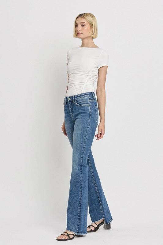 Classic high-rise flare jeans with a fresh slant hem style.
