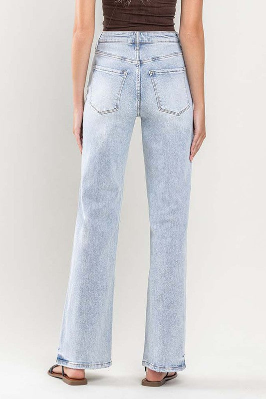 Super high rise flare jeans styled with sandals for a casual outfit
