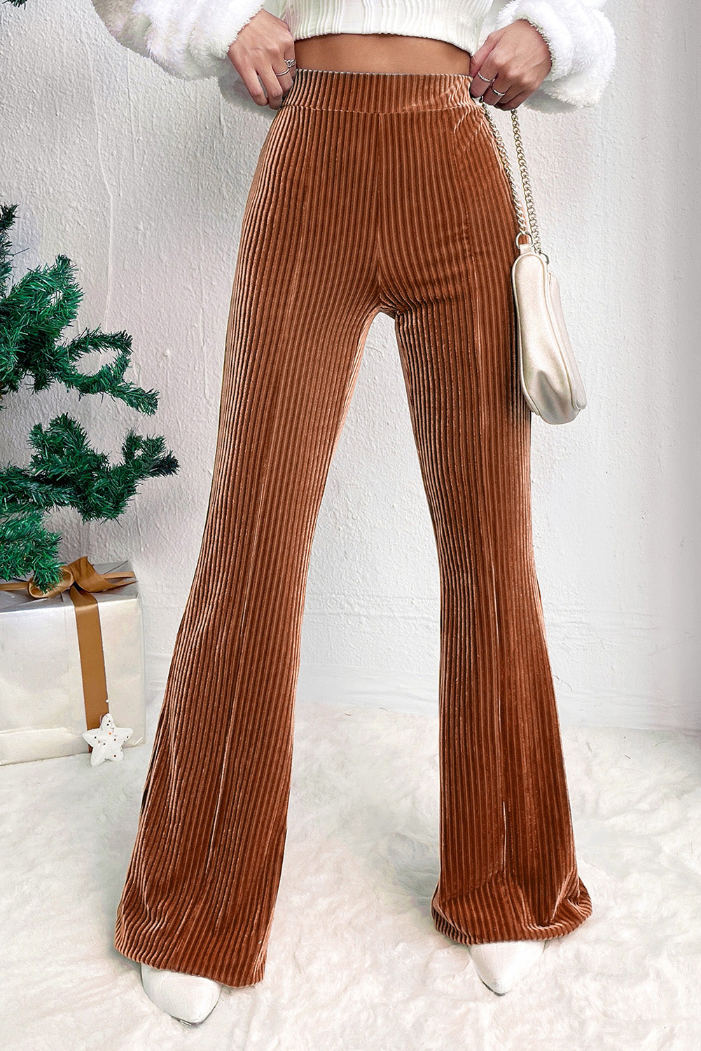 Stylish mocha pants with flared bottoms, perfect for casual and chic outfits.
