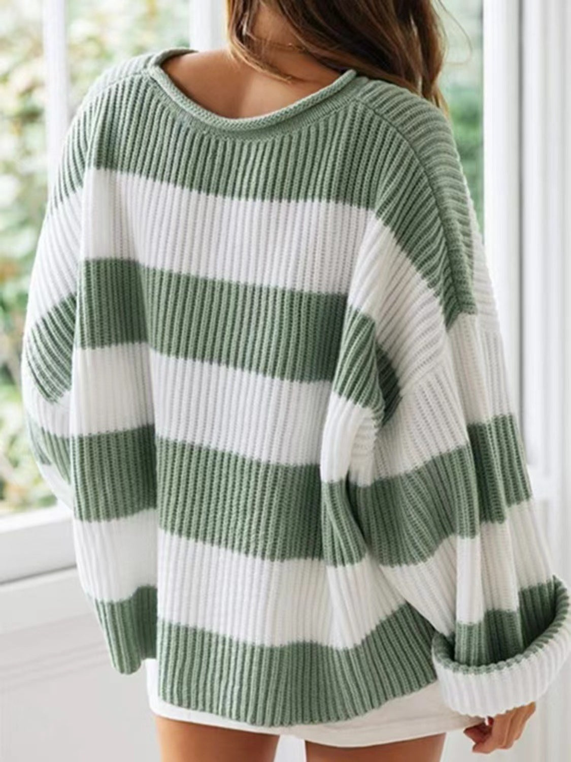 Classic sage and white striped sweater with a comfy, oversized feel.
