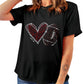 Woman wearing a black rhinestone-embellished football T-shirt
