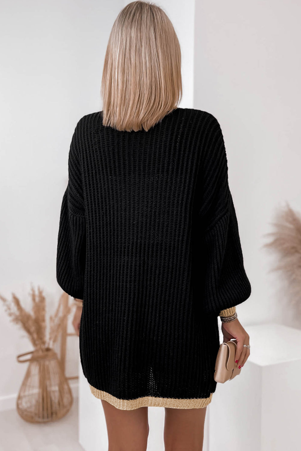 Ribbed knit lantern sleeve cardigan with subtle gold trim details
