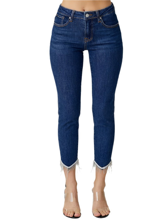 Front view of RISEN mid-rise crop skinny jeans with beaded fringe embellishments at the hem
