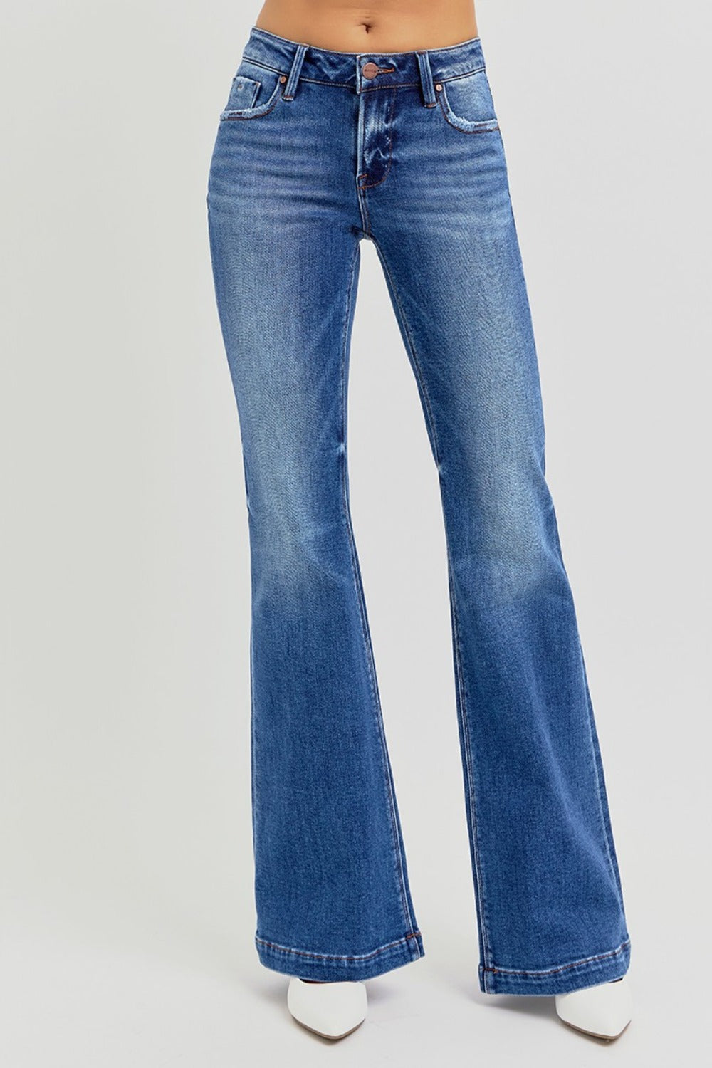 RISEN flare jeans in medium wash styled with a casual outfit.
