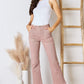 RISEN High Rise Ankle Flare Jeans in a trendy pink color.