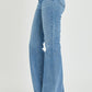 Side view of RISEN High Rise Raw Cut Hem Bootcut Jeans highlighting bootcut style.