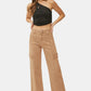 RISEN high rise wide leg cargo jeans styled with a chic top and heels.
