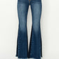 RISEN High Rise Side Shadow Seam Detail Slit Flare Jeans in a dark denim wash, front view.