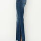 Close-up of RISEN High Rise Side Shadow Seam Detail Slit Flare Jeans, showing the denim texture and shadow seam detail.