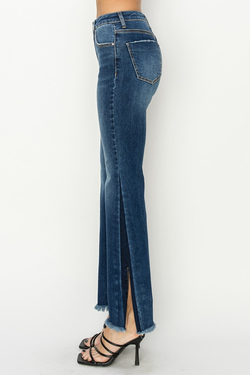 Close-up of RISEN High Rise Side Shadow Seam Detail Slit Flare Jeans, showing the denim texture and shadow seam detail.