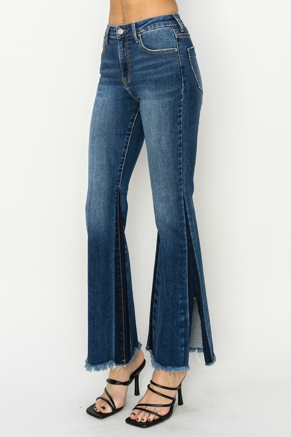 Side view of RISEN High Rise Side Shadow Seam Detail Slit Flare Jeans, highlighting the unique side shadow seam.