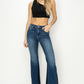 Model wearing RISEN High Rise Side Shadow Seam Detail Slit Flare Jeans, styled with a crop top.