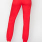 Back view of RISEN High Waisted Jogger Jeans with a flattering fit and stylish red color.
