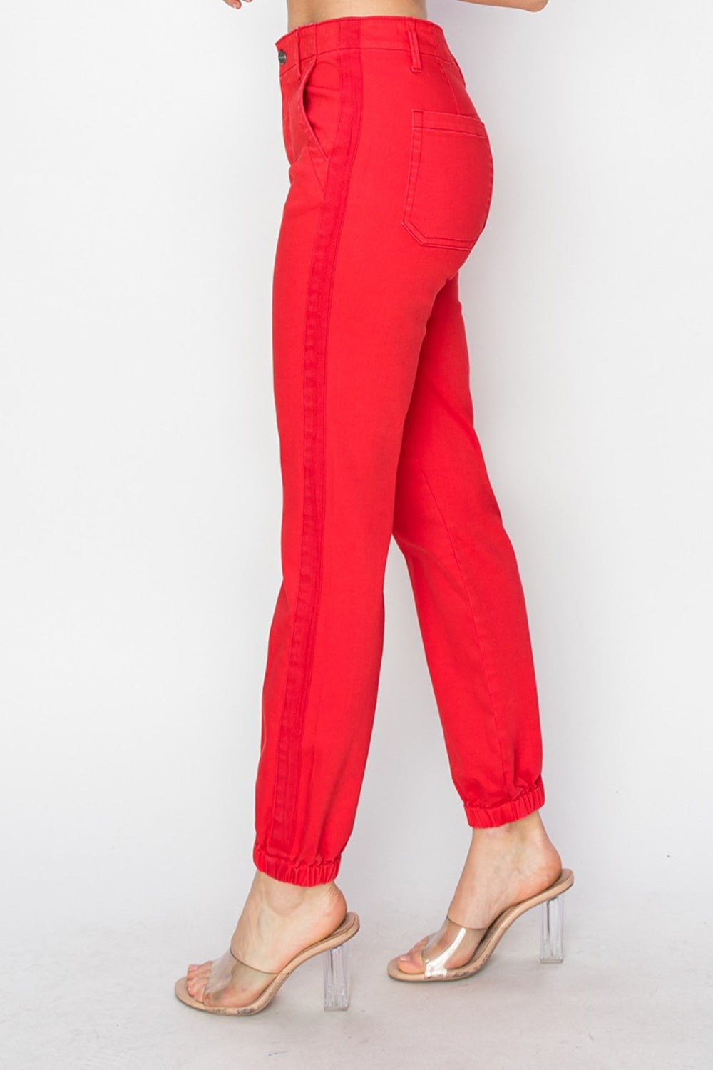 Side view of RISEN High Waisted Jogger Jeans showing elasticized cuffs and functional pockets.
