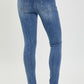 Back view of RISEN Mid Rise Ankle Skinny Jeans, highlighting the fit and pocket design.