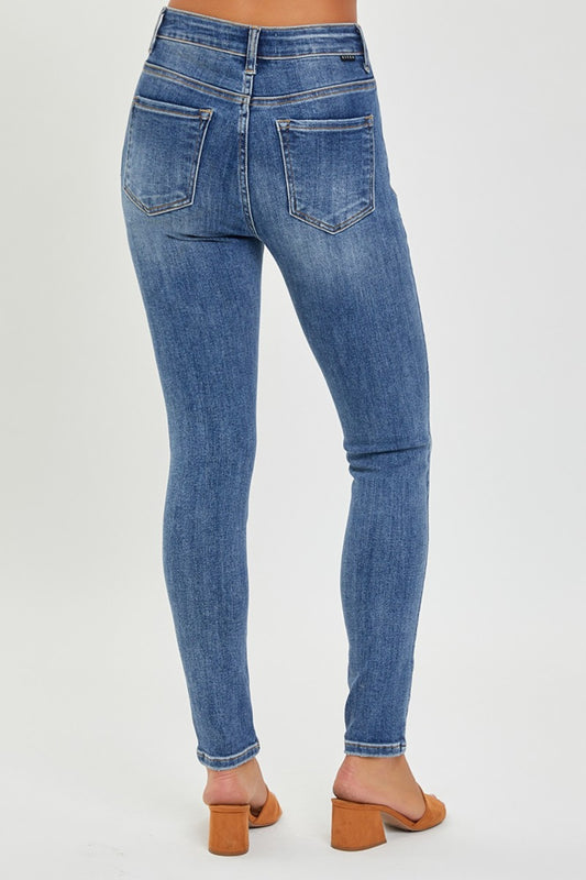 Back view of RISEN Mid Rise Ankle Skinny Jeans, highlighting the fit and pocket design.