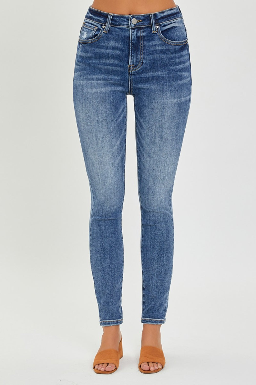 RISEN Mid Rise Ankle Skinny Jeans in a mid-wash, offering a versatile option for any occasion.