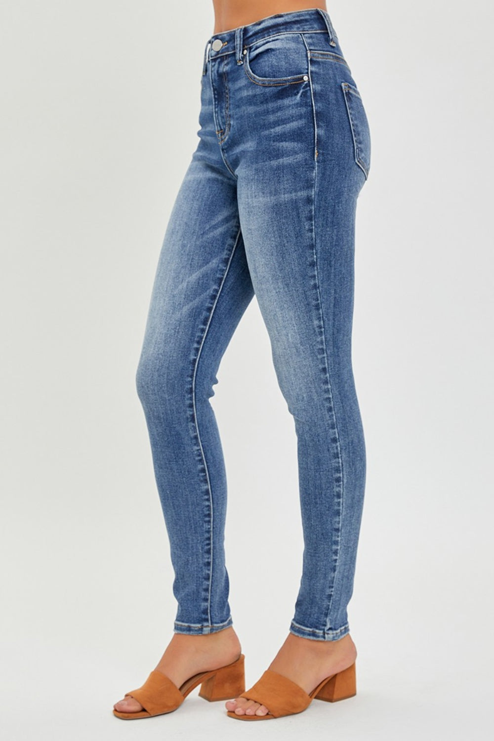 Side view of RISEN Mid Rise Ankle Skinny Jeans, illustrating the flattering silhouette.