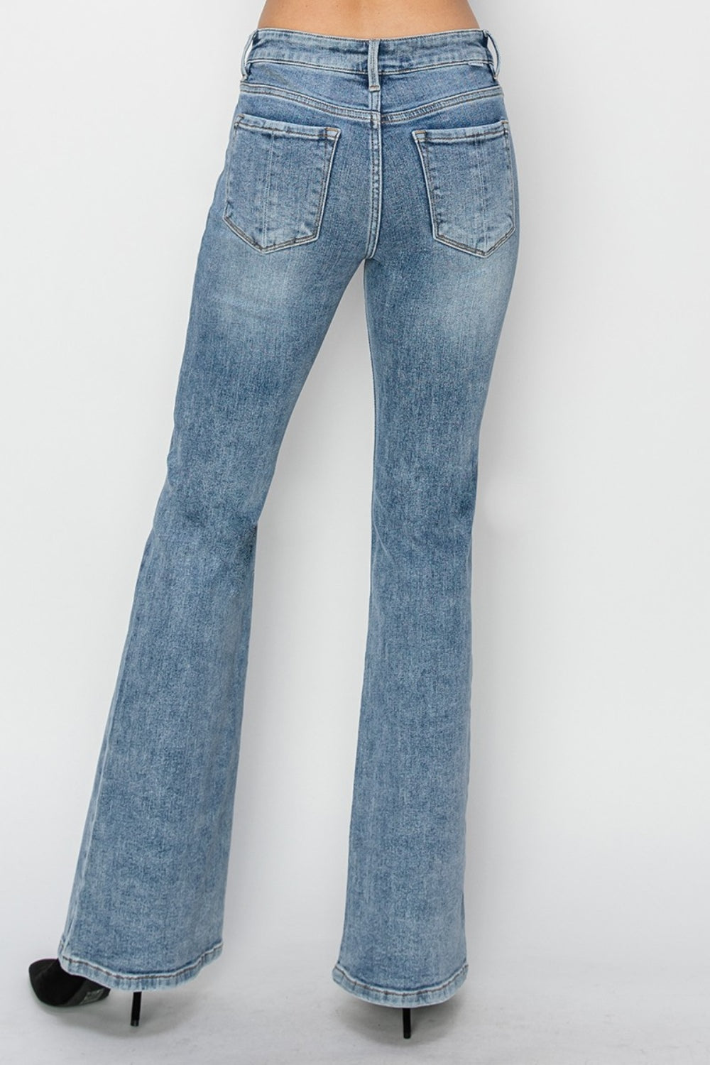 Back view of RISEN Mid Rise Bootcut Jeans highlighting the fit and back pockets.