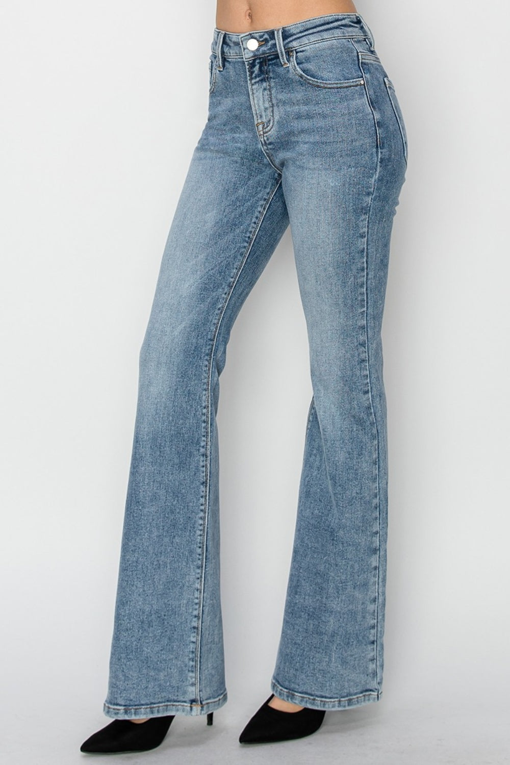 RISEN Mid Rise Bootcut Jeans paired with heels, showing a chic outfit combination.