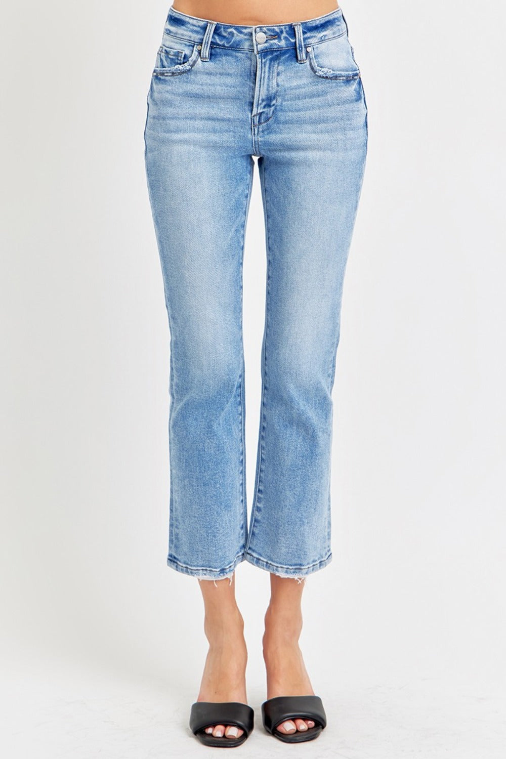 Trendy low rise jeans styled with a raw hem finish.
