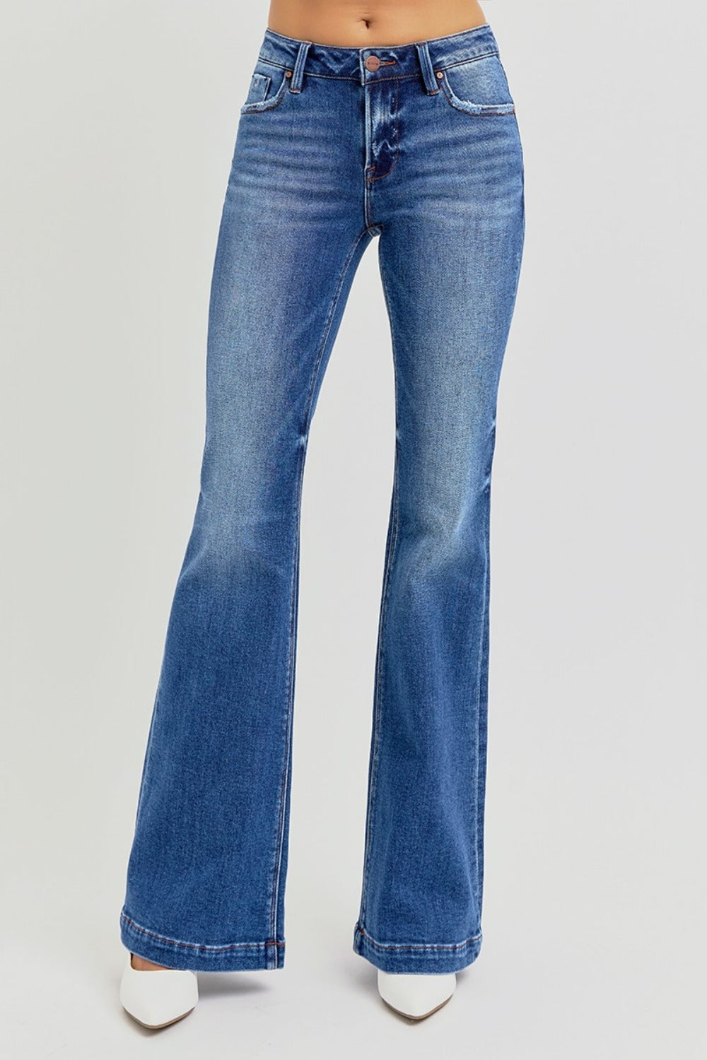 RISEN flare jeans in medium wash styled with a casual outfit.
