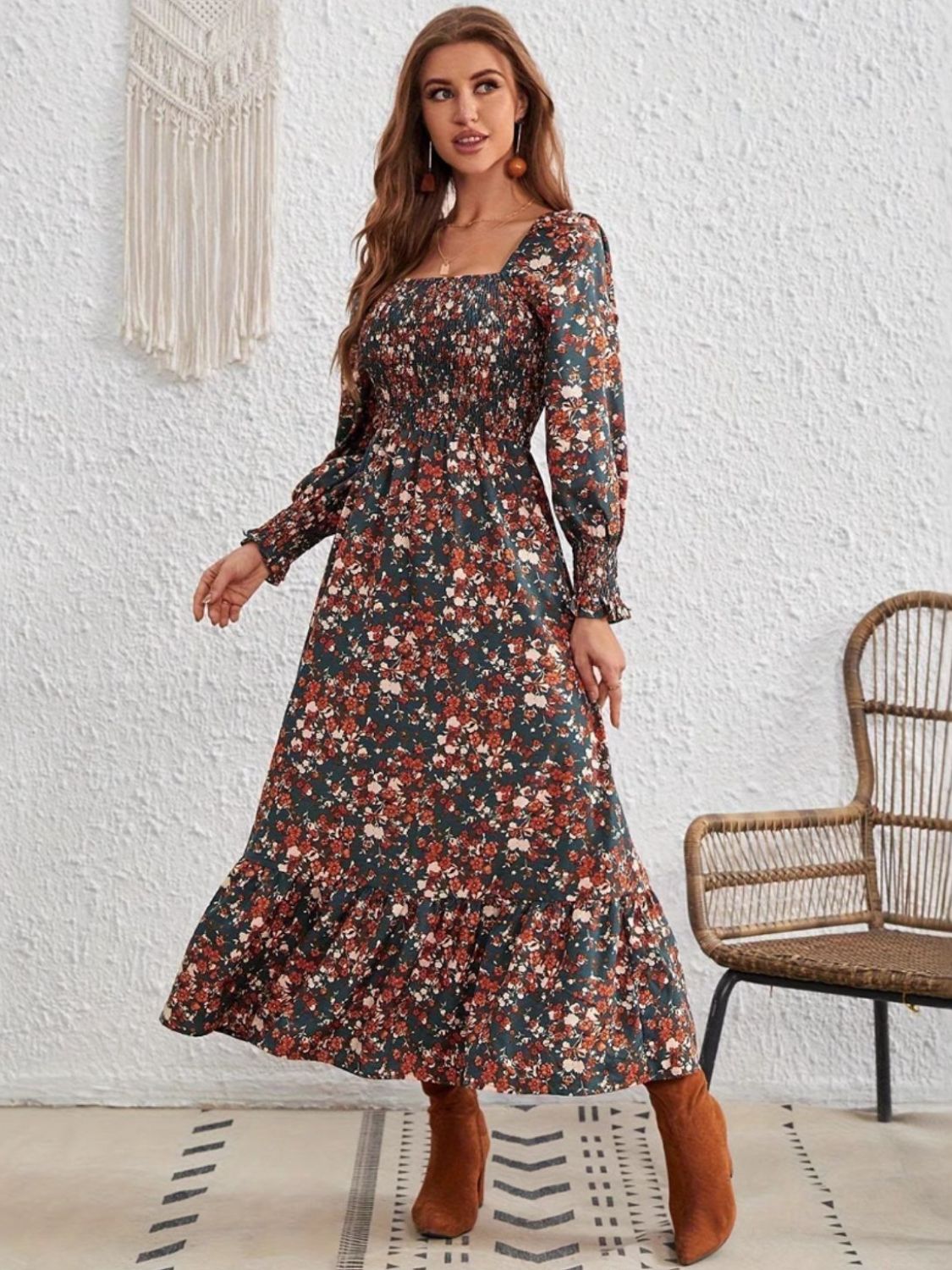 Romantic long sleeve floral dress styled with statement earrings and boots.
