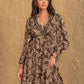 Flowy and relaxed printed long sleeve dress with tiered skirt.
