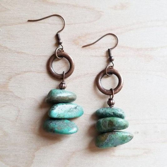 Rustic turquoise dangle earrings with natural stones and rustic metal accents.