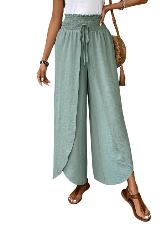 High-rise wide-leg pants in soft sage green with a smocked waistband