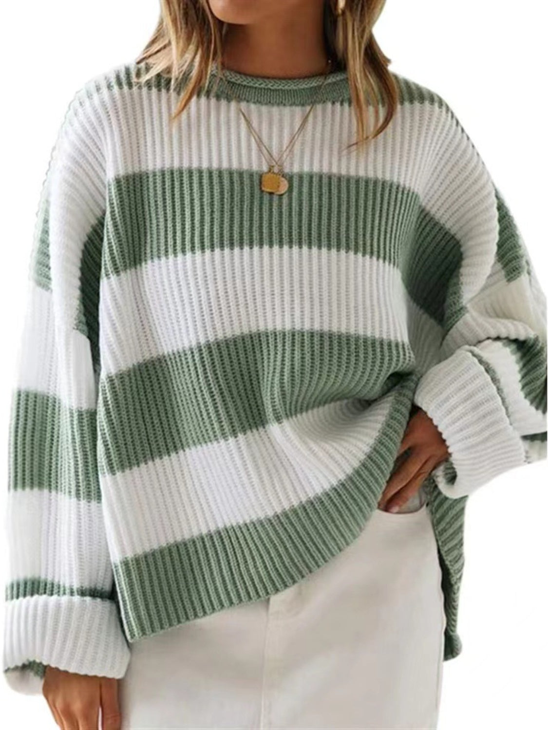 Sage striped sweater with a ribbed texture for a retro-inspired look.
